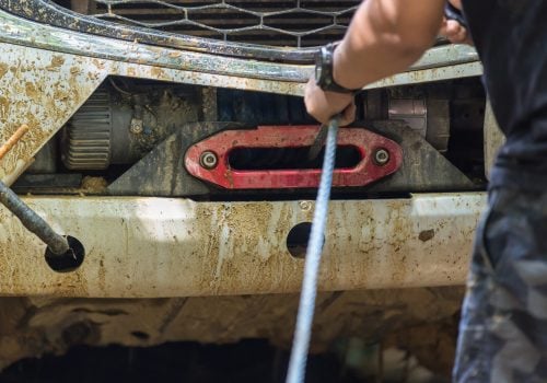 man-use-winch-device-at-front-of-pick-up-off-road-2026-01-08-23-59-02-utc